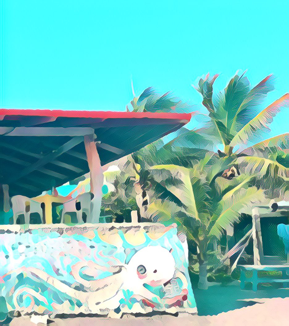 Las Chozas - View from Playa Miramar with Octopus Mural and Palm Trees